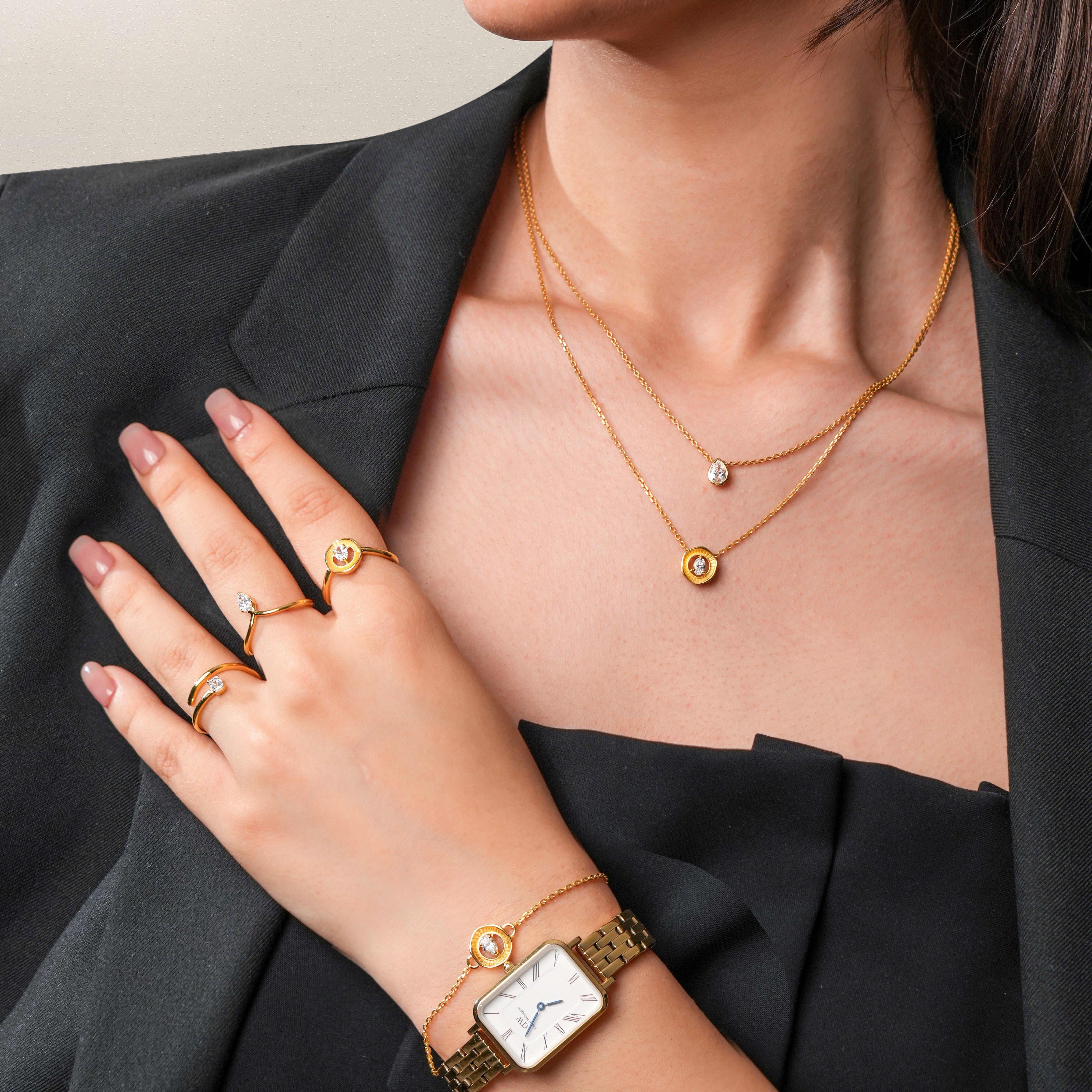 Model wearing Averra bracelet with a watch, with 24KT gold micron plating for everyday styling