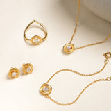 Flatlay of Averra bracelet along with the averra collection with lab grown diamonds in 24KT gold micron plated finish